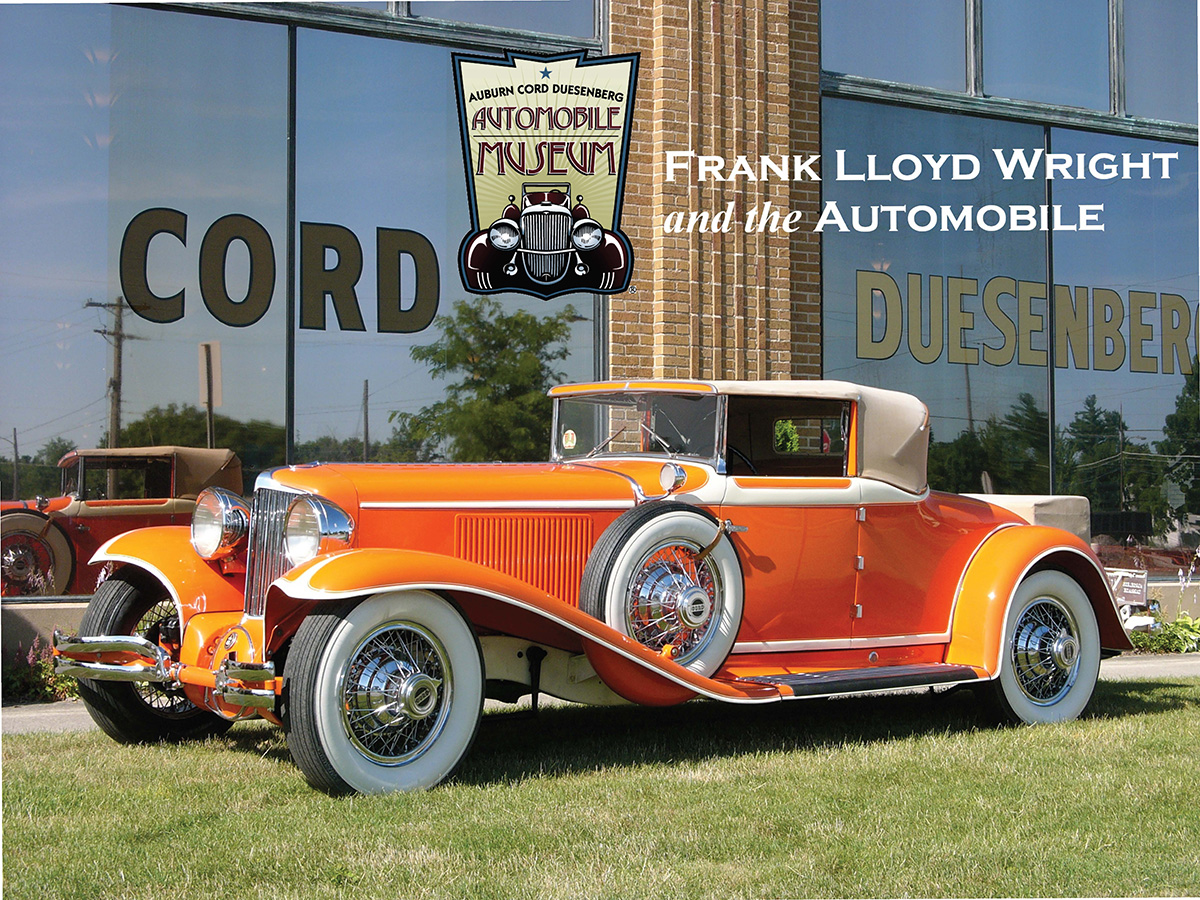 Frank Lloyd Wright's Orange car is parked in front of the Auburn Cord Duesenberg Museum.