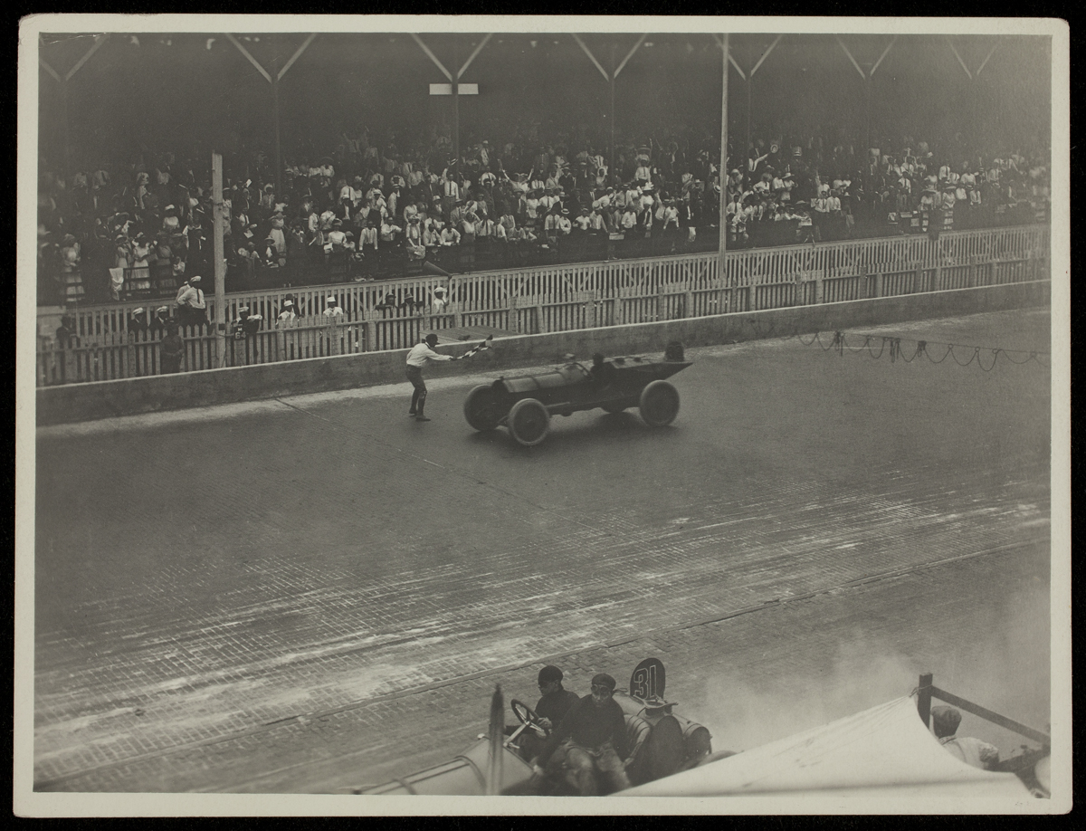The Marmon Wasp Driven by Ray Harroun, Winner of the 1911 Indianapolis 500 crosses the finish line.